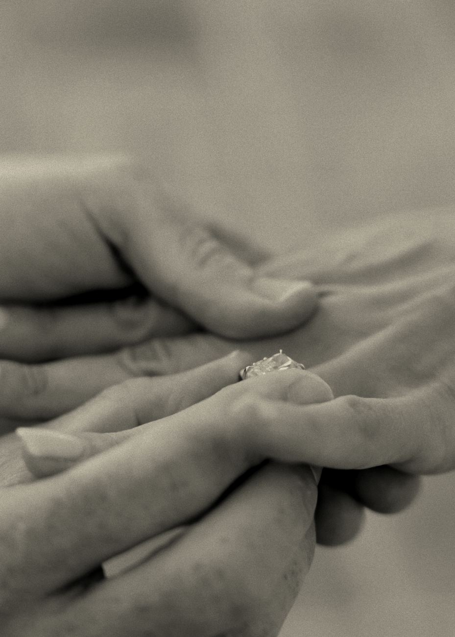 Their hands and the engagement ring